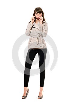 girl wearing a coat and black leggings. Isolated