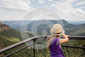 A girl wearing hat looking at the landscape of Blue Mountains