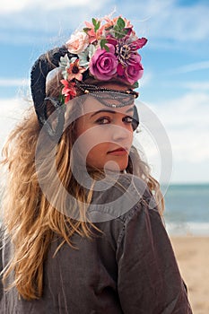 Girl back beach flowers crown, De Panne, Belgium photo