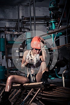 Girl wearing a helmet in the boiler room