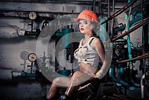 Girl wearing a helmet in the boiler room