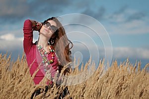 Girl wearing lots of jewelry shorten arm