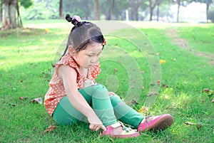 Girl wearing shoes on the lawn