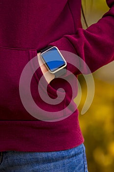 Girl wearing smart-watch on her hand