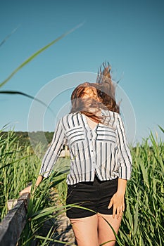 Girl wearing a striped shirt at Reed National Reservation, Sic Village, Romania