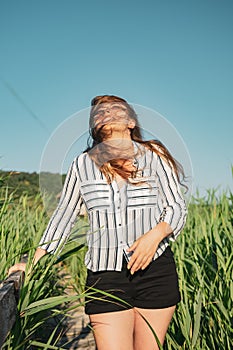 Girl wearing a striped shirt at Reed National Reservation, Sic Village, Romania