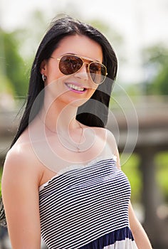 Girl wearing sunglasses.