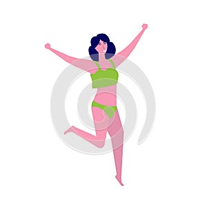 Girl wearing swimsuit jumping on beach. Summer vacation concept.