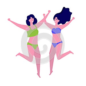 Girl wearing swimsuit jumping on beach. Summer vacation concept.