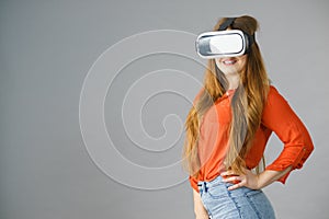 Girl wearing virtual reality goggles.