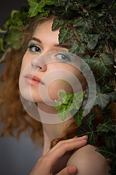 Girl wearing a wreath of ivy leaves