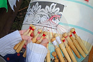 Girl is weaving lace