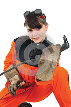 Girl welder working with burner