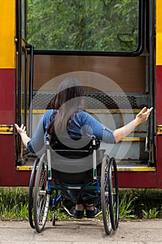 Girl on wheelchair having problem with entering the tramway