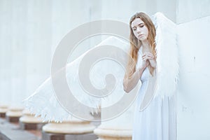 Girl with white angel wings