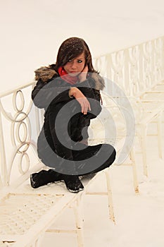 Girl on the white bench