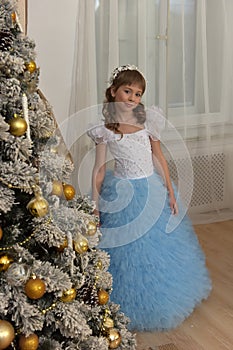Girl in white with blue festive dress