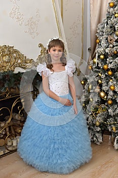 Girl in white with blue festive dress