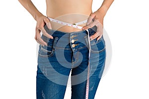 Girl on white in blue jeans and tape measure.