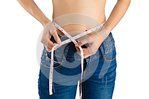 Girl on white in blue jeans and tape measure.