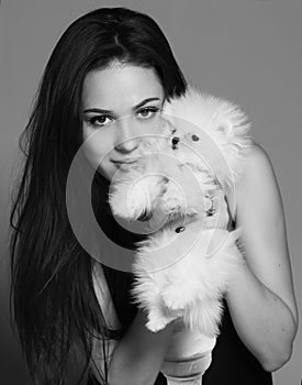 Girl with a white dog photo