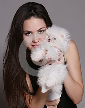 Girl with a white dog photo