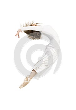 A girl in a white dress dancing ballet