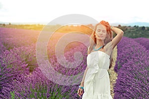 Girl in white dress on the field of lavender