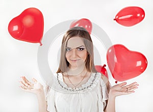 Girl in white dress with heart-shaped baloons