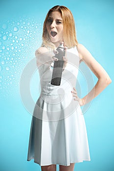 girl in a white dress holding a bottle with hairspray