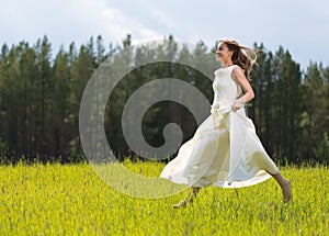 Girl in white dress jumping