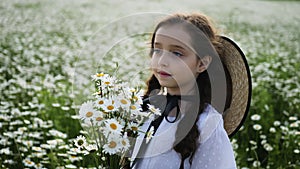 Girl in a white dress of seven years with big eyes