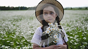 Girl in a white dress of seven years with big eyes