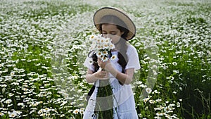 Girl in a white dress of seven years with big eyes