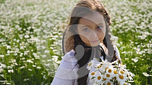 Girl in a white dress of seven years with big eyes