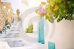 Girl in white dresses having fun outdoors on Mykonos streets