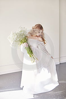 Girl white light dress and curly hair, portrait of woman with fl