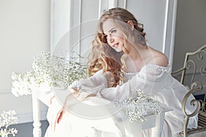 Girl white light dress and curly hair, portrait of woman with fl