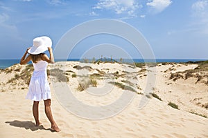 Girl in white by the sea