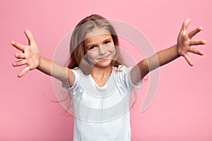 Girl in white t-shirt with arms wide open going to hug her family,