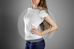 Girl in white t-shirt and blue jeans. Ready for your design. Closeup. Isolated