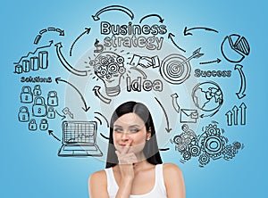 Girl in white top and business icons on blue wall