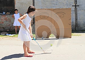 Girl in white training floorball