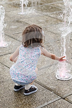 Girl who wallow in a fountain on a hot summer day