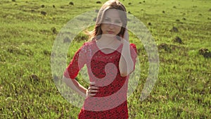 Girl wind nature. girl is standing in the field of green grass. Woman lifestyle freedom