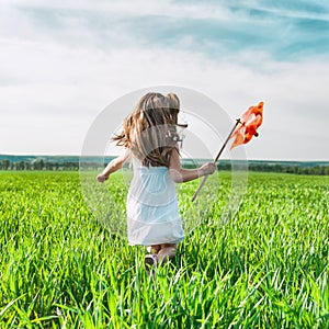 Girl with a windmill in hand