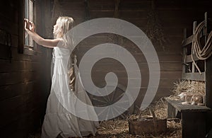 Girl at the window in the shed