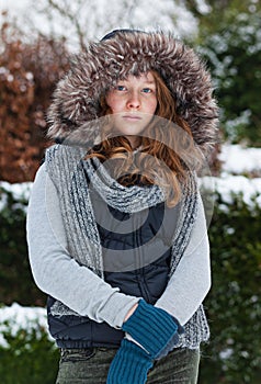 Girl in winter cloths and fur hood