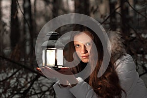 Girl in winter forest