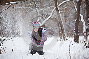 Girl in winter forest fun